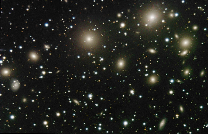 The galaxy cluster Abell 426, also known as the Perseus Cluster. It contains hundreds of galaxies. This image is a small part of the cluster. I spotted 54 galaxies.